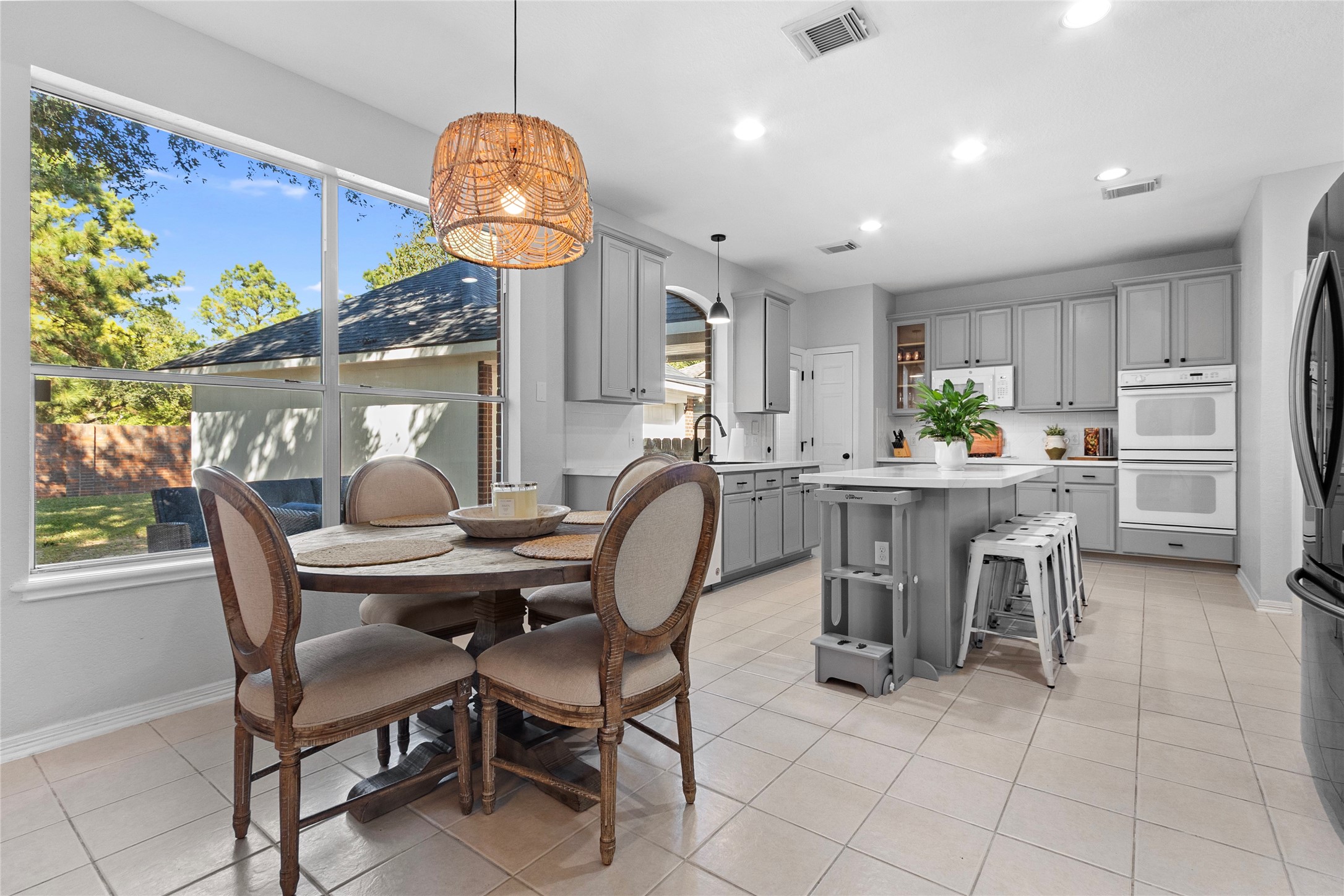 9114 Kirkstone Drive Spring, TX 77379 - Photo 9 of 31 a dining room filled chandelier and kitchen view