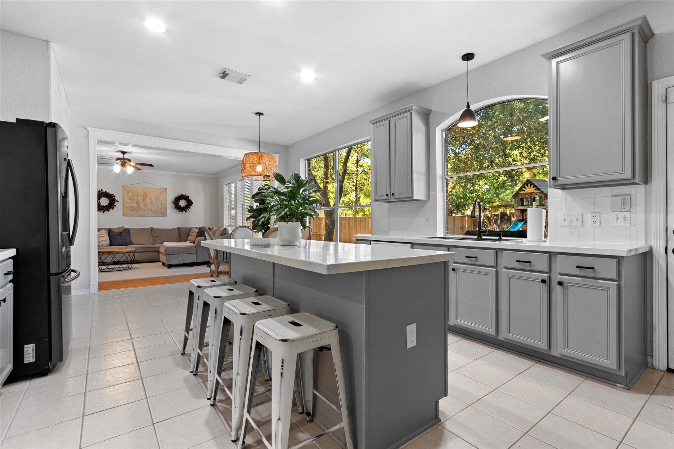 9114 Kirkstone Drive Spring, TX 77379 - Photo 10 of 31 a kitchen with stainless steel appliances a table and chairs in it