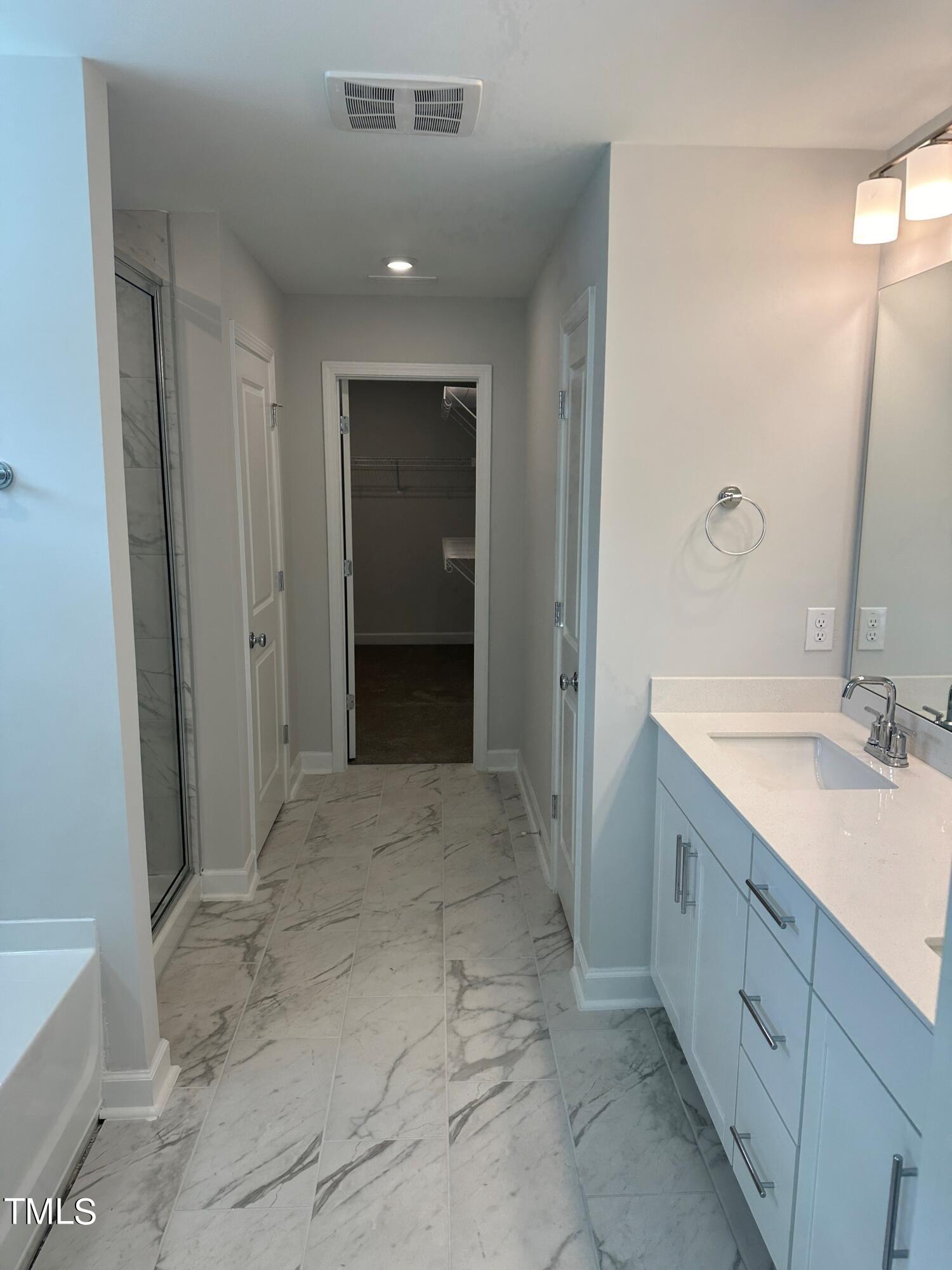 1200 Dimaggio Drive, Unit 25 Raleigh, NC 27616 - Photo 3 of 8 a bathroom with a sink and a mirror