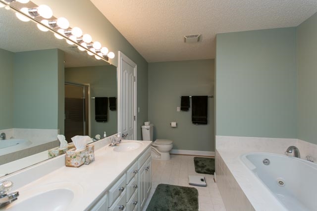 3213 Arrowhead Road Harrisonburg, VA 22801 - Photo 15 of 41 Full master bathroom with double vanity and whirlpool, direct entrance from the master bedroom, plus an entrance from the adjacent hallway.