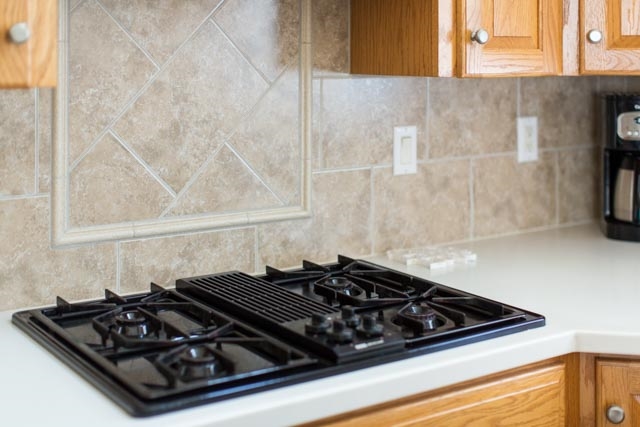 3213 Arrowhead Road Harrisonburg, VA 22801 - Photo 26 of 41 A closer look at the gas cooktop and lovely, neutral colored backsplash in the kitchen.