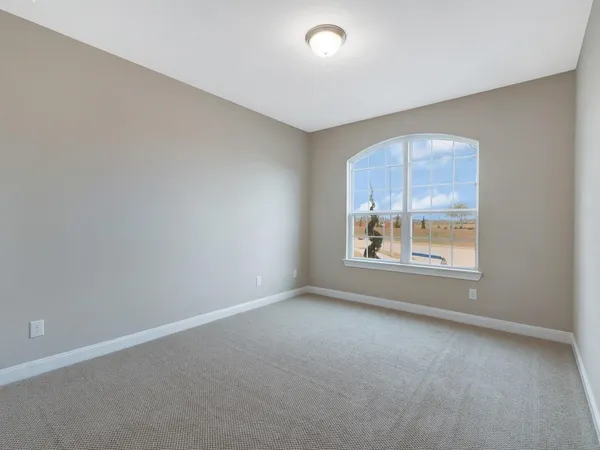 an empty room with windows and window