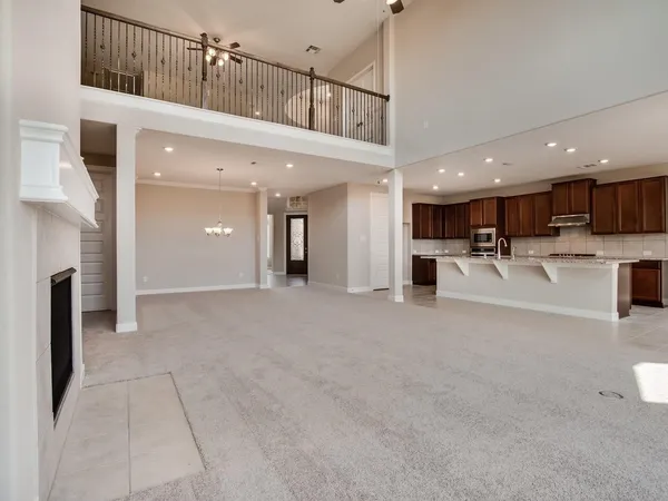 a view of a kitchen with a sink and cabinets