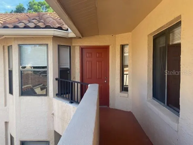 a view of kitchen with granite countertop cabinets