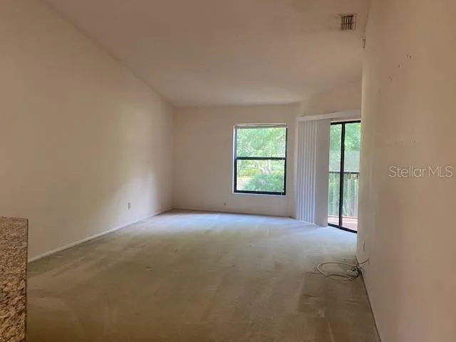 an empty room with windows