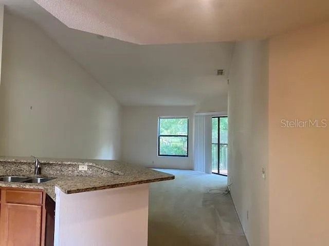 a view of a kitchen cabinets and a stove top oven
