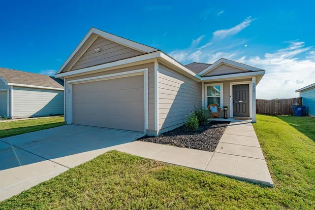 a view of a backyard of the house