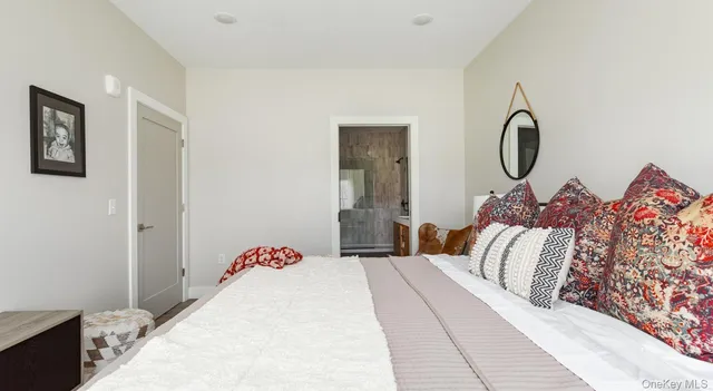 a bedroom with a bed and a lamp