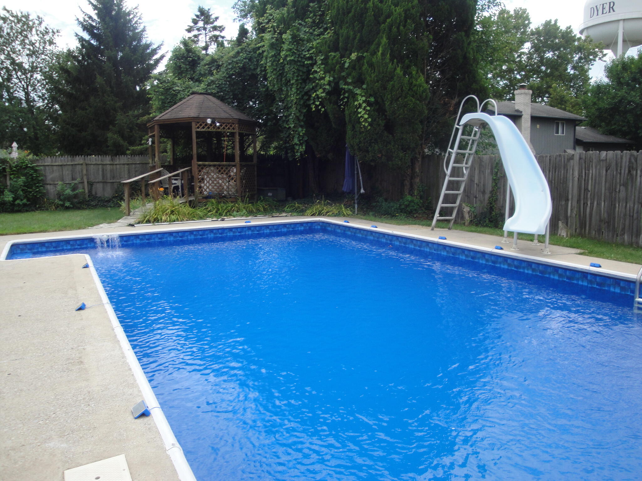2308 Flint Court Dyer, IN 46311 - Photo 34 of 37 a view of swimming pool with a backyard and trees