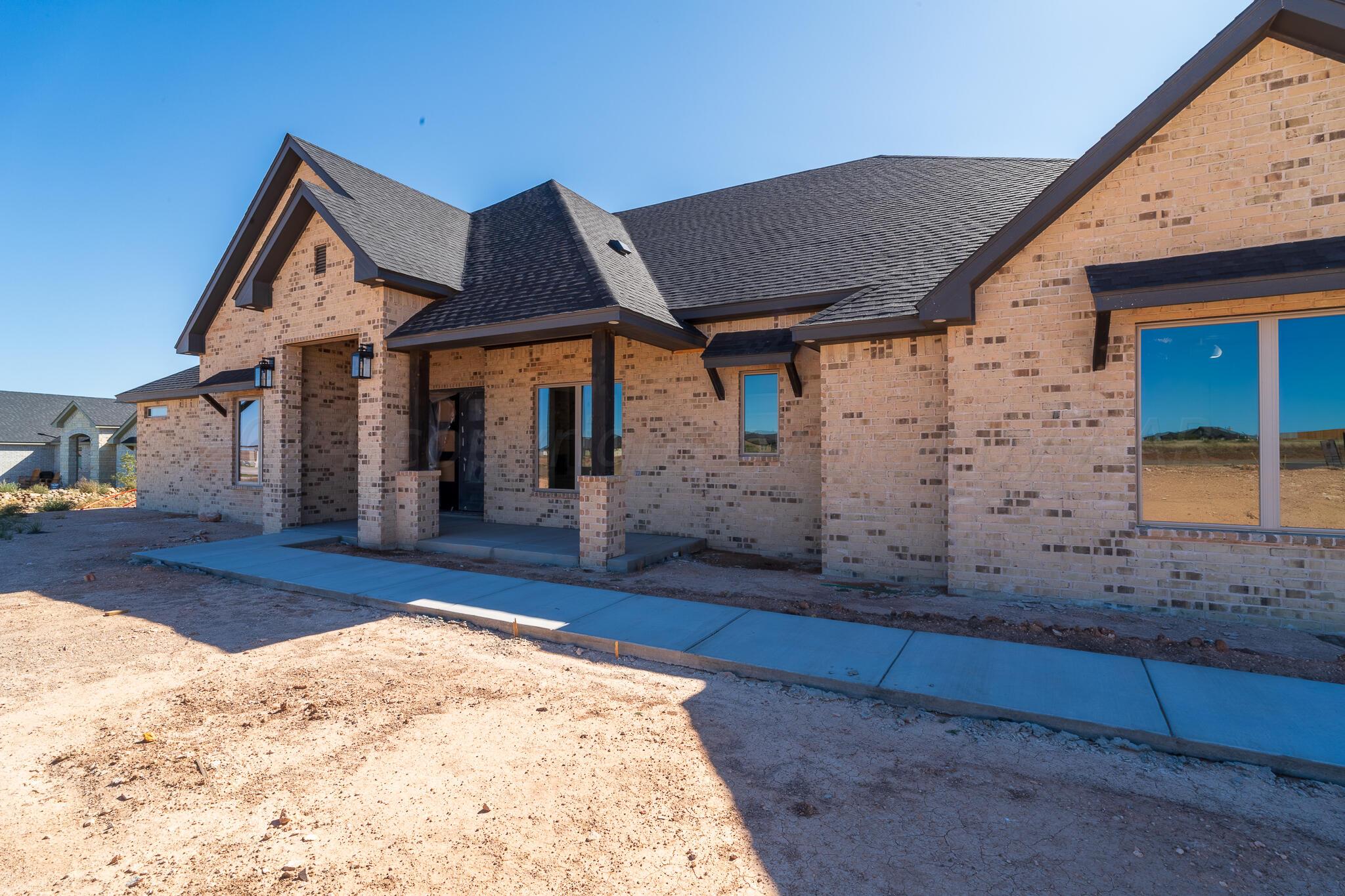 19401 Falling Rock Road Amarillo, TX 79124 - Photo 4 of 5 a view of a house with a wooden fence