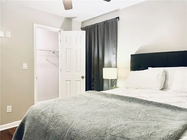 a large white bed in a large room