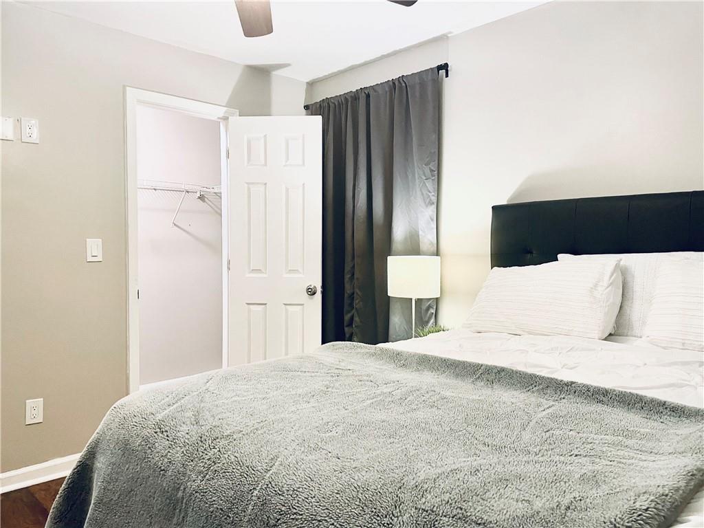 357 Waits Drive Southwest, Unit 1 Atlanta, GA 30331 - Photo 2 of 8 a large white bed in a large room