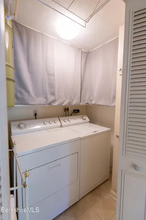 a room with a sink and a mirror