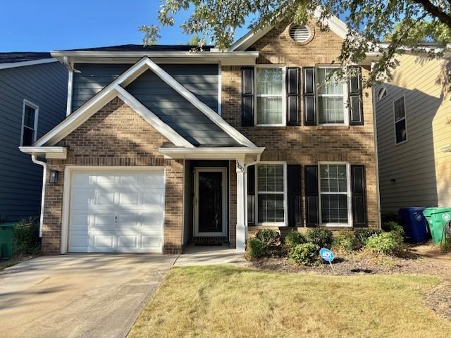 1300 Gates Circle Southeast Atlanta, GA 30316 - Photo 1 of 13 a front view of a house with a yard