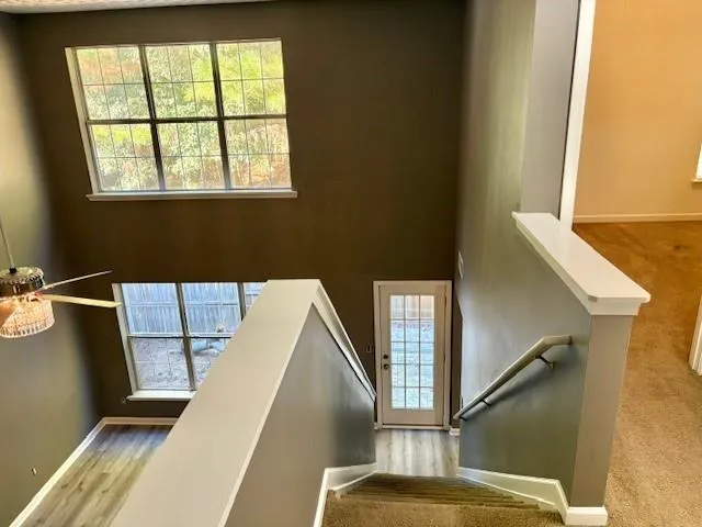 a view of balcony with wooden floor