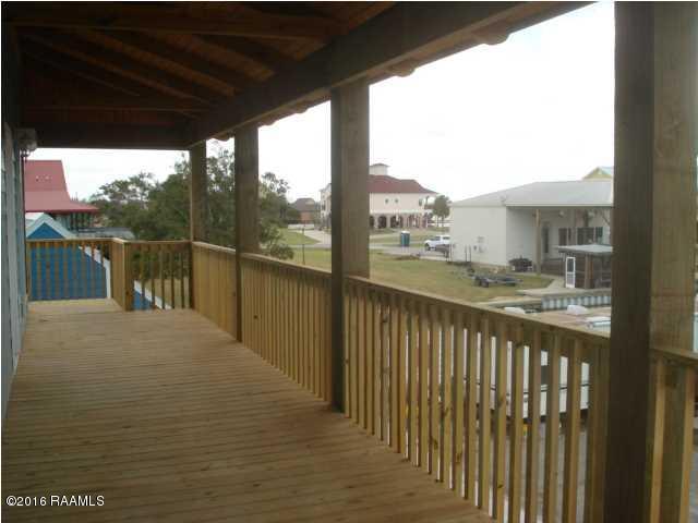 461 Lake Breeze Road, Unit E Hackberry, LA 70645 - Photo 11 of 20 Wonderful Covered Porch