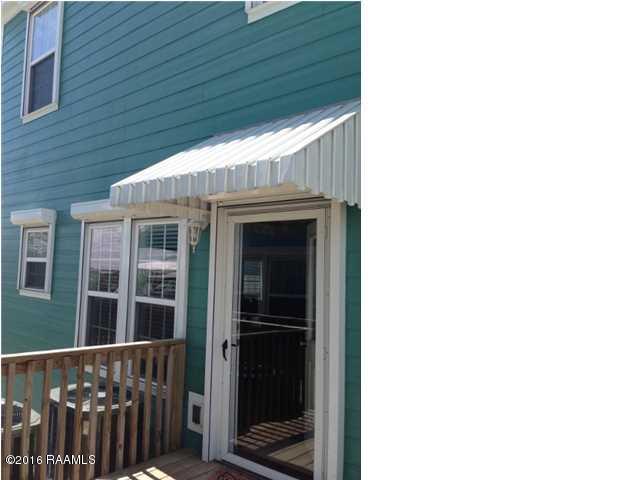 461 Lake Breeze Road, Unit E Hackberry, LA 70645 - Photo 19 of 20 back door outside