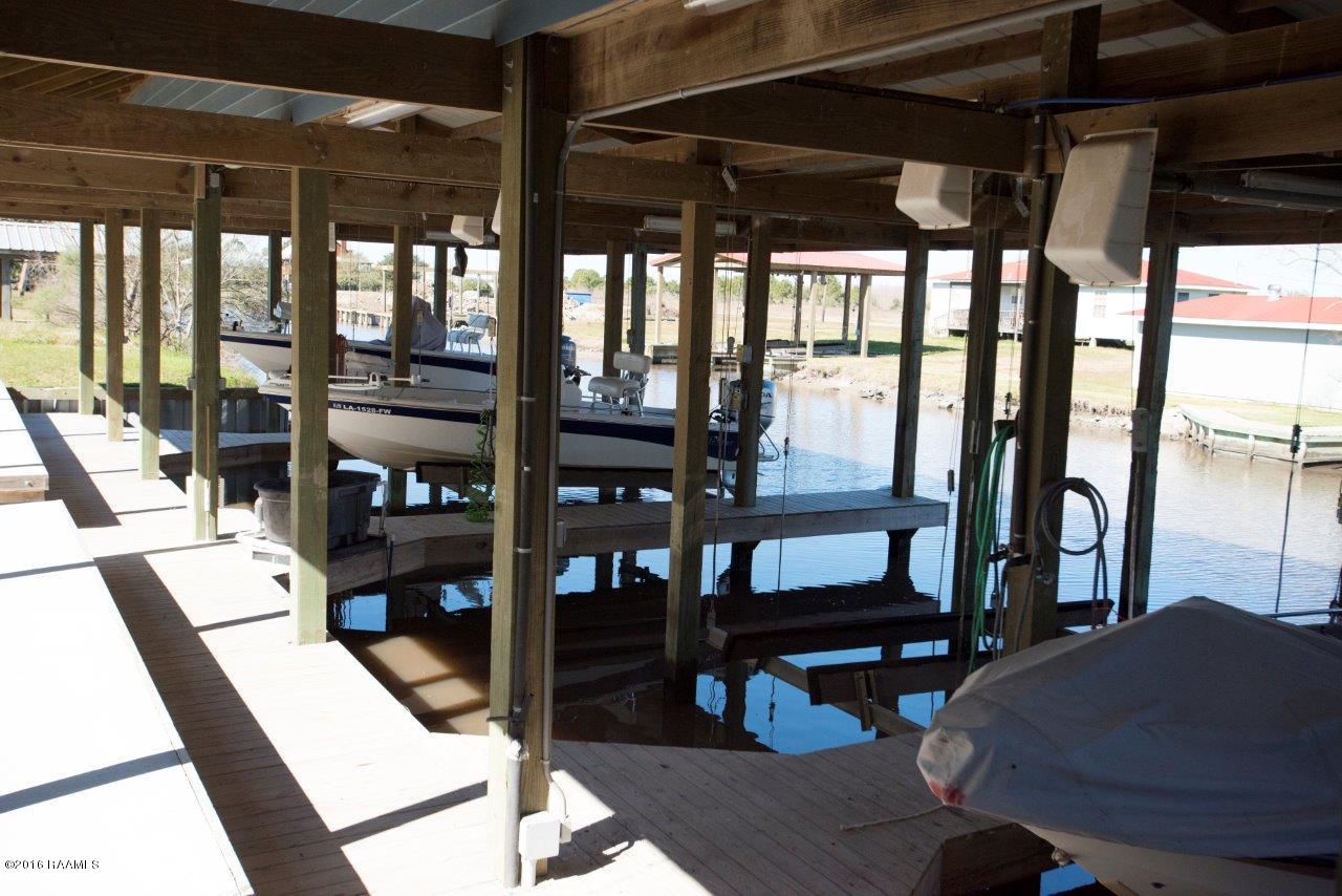 461 Lake Breeze Road, Unit E Hackberry, LA 70645 - Photo 3 of 20 Covered Boathouse