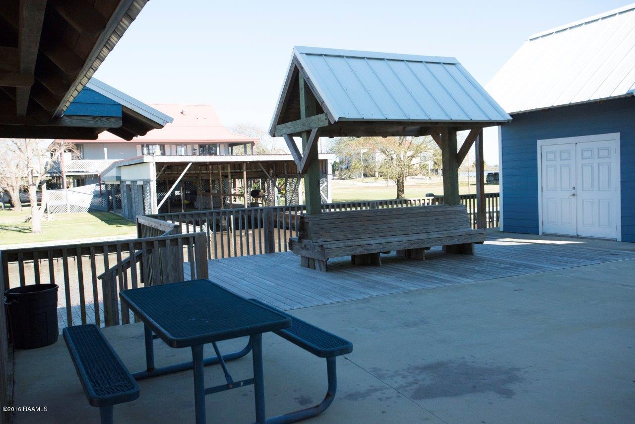 461 Lake Breeze Road, Unit E Hackberry, LA 70645 - Photo 4 of 20 Common area deck and building
