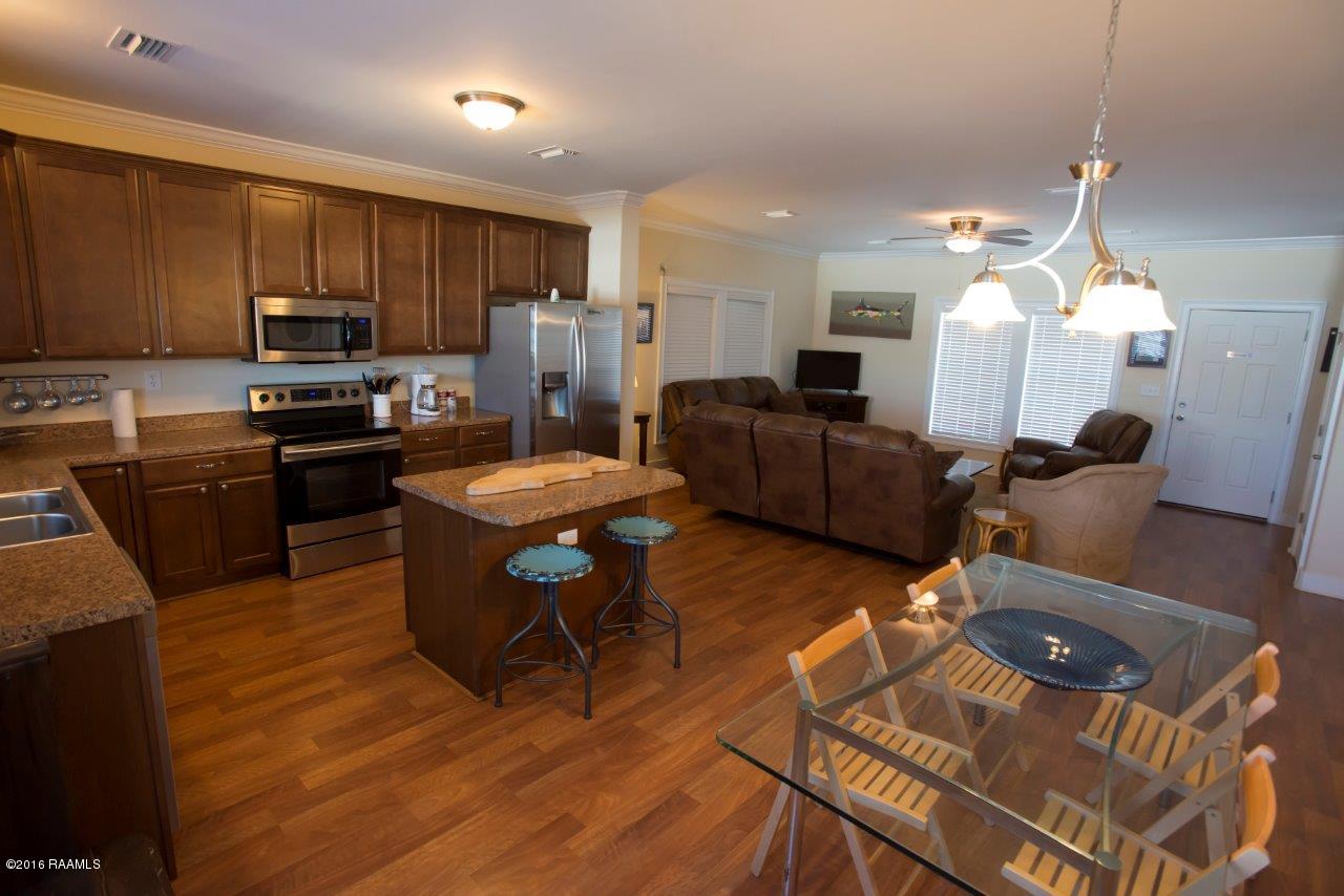 461 Lake Breeze Road, Unit E Hackberry, LA 70645 - Photo 6 of 20 Great room Kitchen