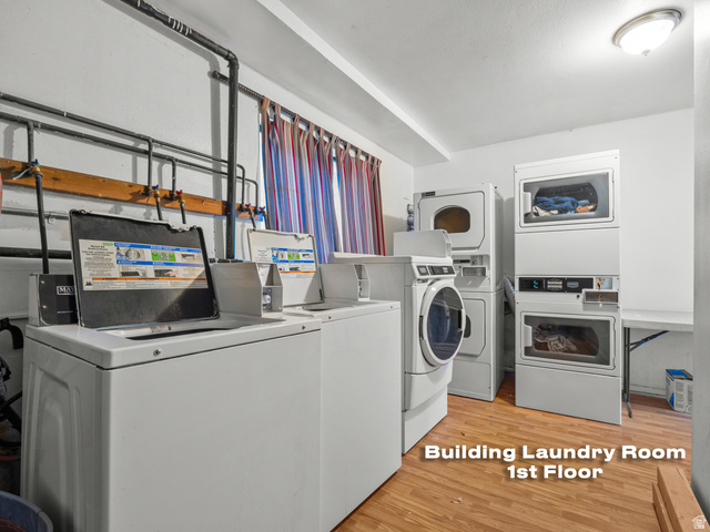 460 200 South Provo, UT 84606 - Photo 10 of 66 Shared laundry room with light wood-type flooring, separate washer and dryer, and stacked washing machine and dryer