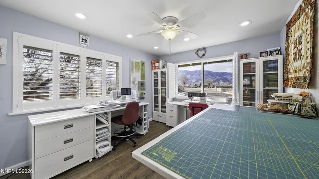 a large white kitchen with a large window