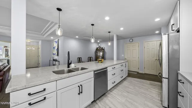 a spacious bathroom with a granite countertop sink mirror and a shower
