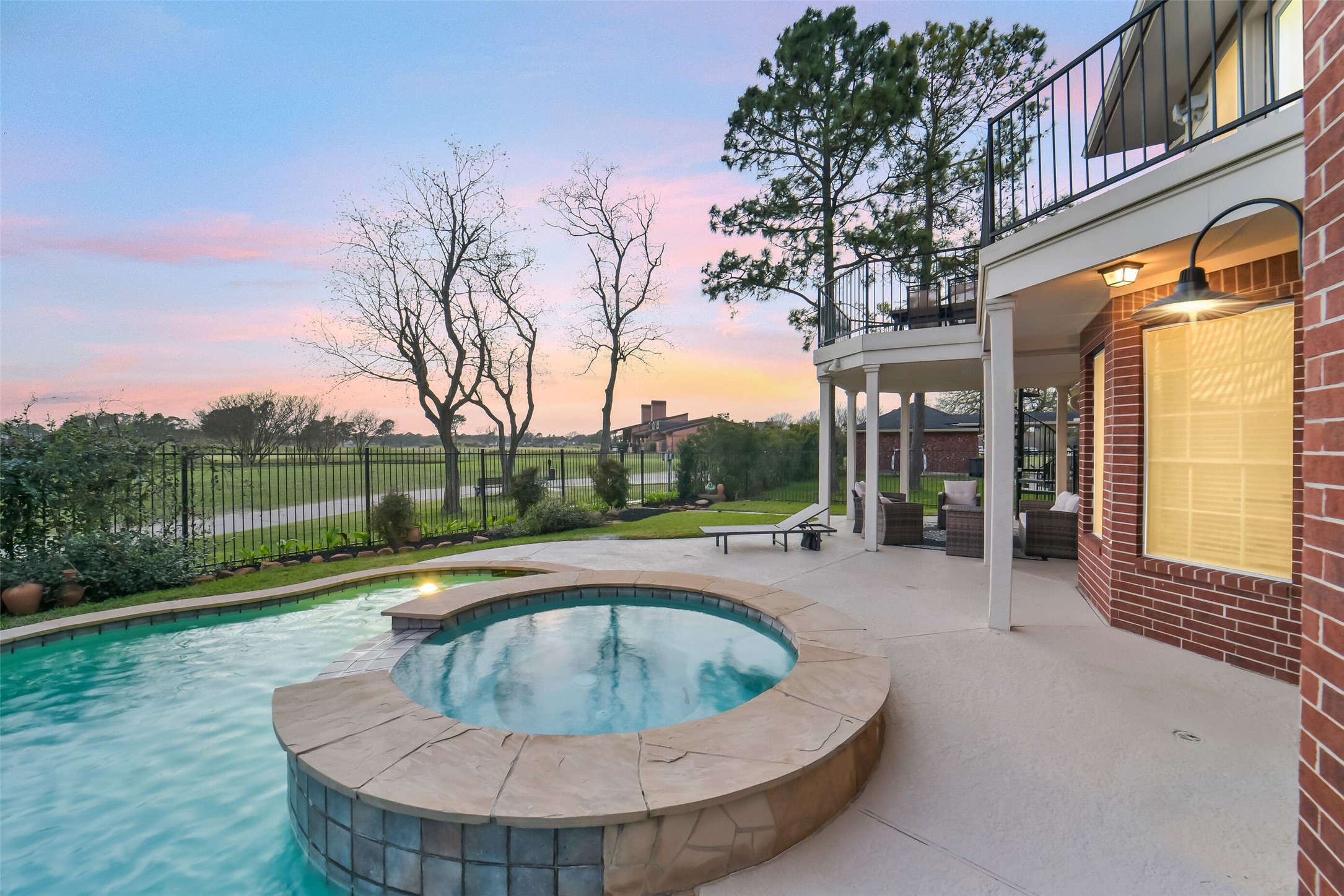 24403 Falcon Point Drive Katy, TX 77494 - Photo 32 of 32 Another look at the sparkling pool and built-in spa, designed for ultimate relaxation and year-round enjoyment.
