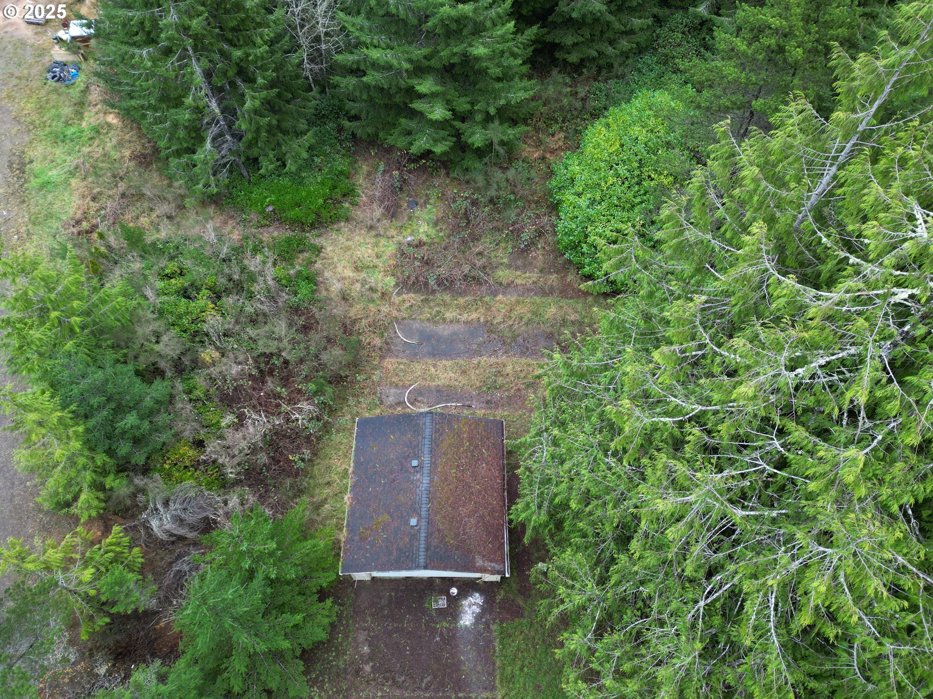 Hemlock Street, Unit TL 2200 Florence, OR 97439 - Photo 2 of 17 an aerial view of a house with a yard