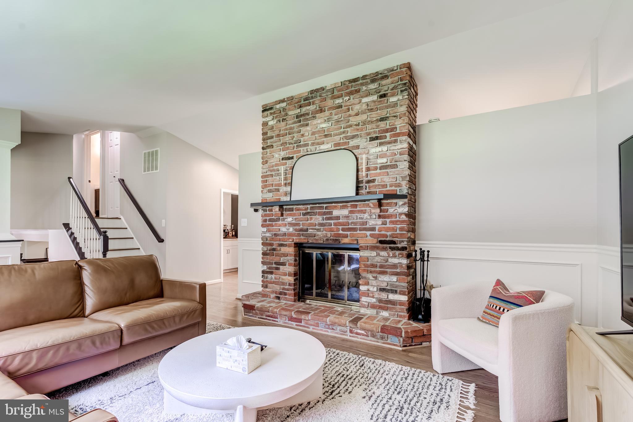11926 Appling Valley Road Fairfax, VA 22030 - Photo 5 of 60 a living room with furniture and a fireplace