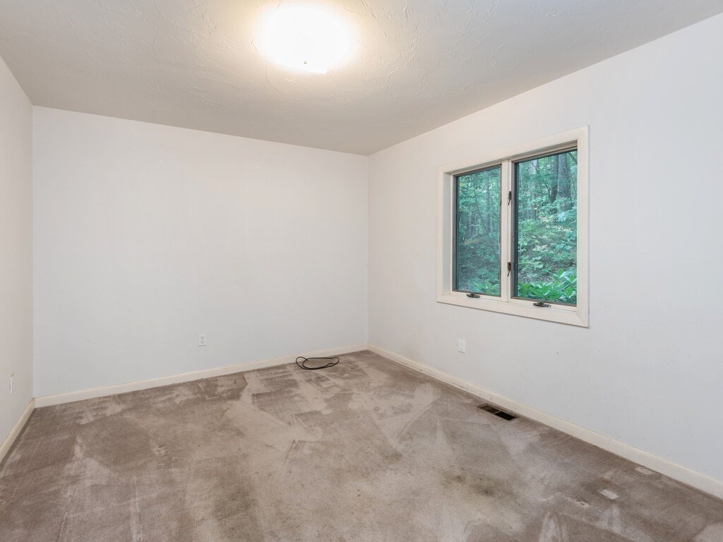 49 Denfield Road Charlton, MA 01507 - Photo 14 of 42 an empty room with a window