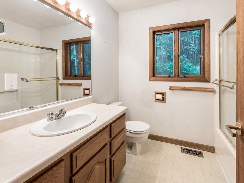 49 Denfield Road Charlton, MA 01507 - Photo 16 of 42 a bathroom with a sink and a mirror
