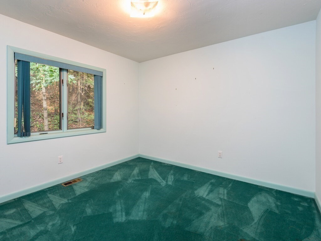 49 Denfield Road Charlton, MA 01507 - Photo 17 of 42 a view of an empty room with window