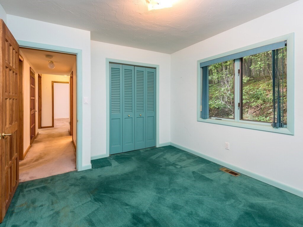 49 Denfield Road Charlton, MA 01507 - Photo 18 of 42 an empty room with windows and closet