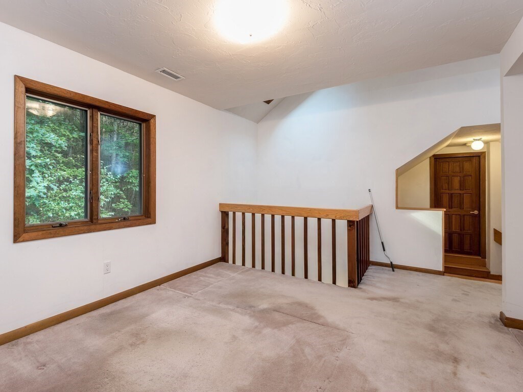 49 Denfield Road Charlton, MA 01507 - Photo 22 of 42 a view of an empty room with a window