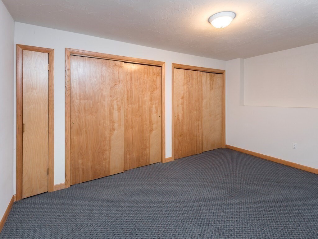 49 Denfield Road Charlton, MA 01507 - Photo 30 of 42 an empty room with a window