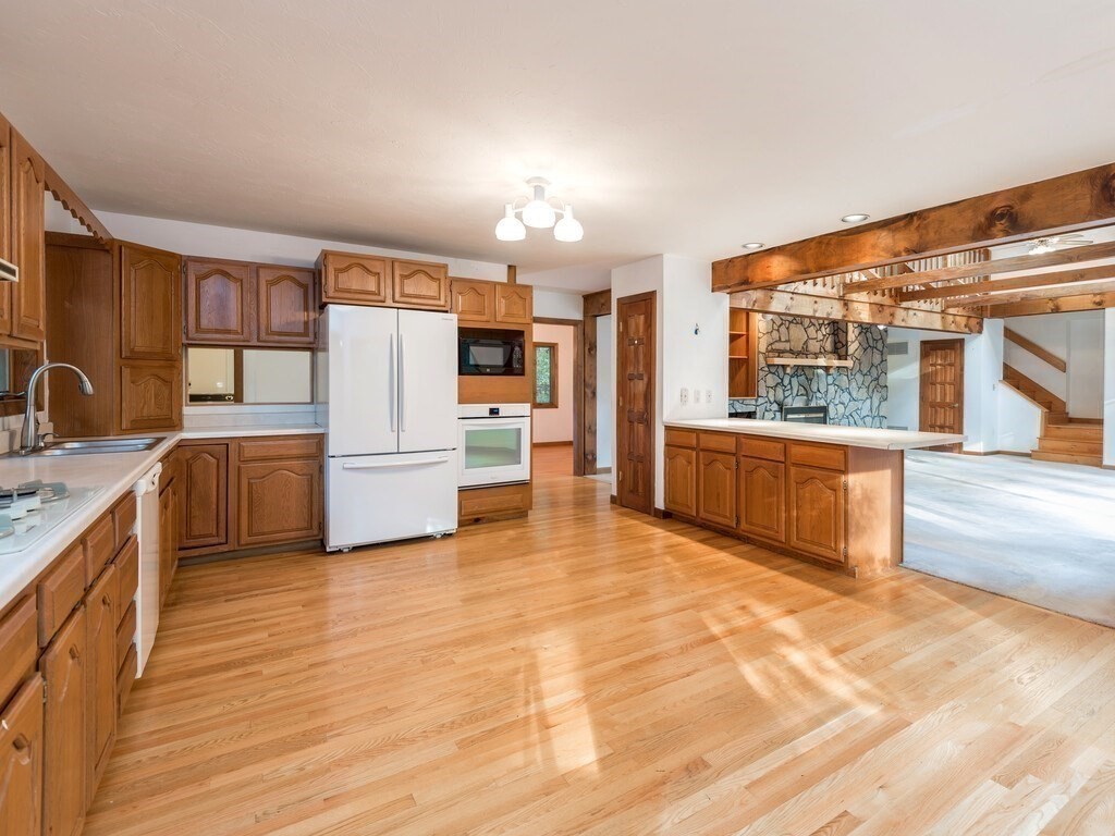 49 Denfield Road Charlton, MA 01507 - Photo 3 of 42 a large kitchen with stainless steel appliances double vanity and a large window