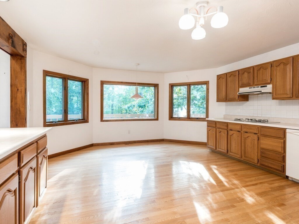 49 Denfield Road Charlton, MA 01507 - Photo 5 of 42 a view of a kitchen with a sink cabinets and a window