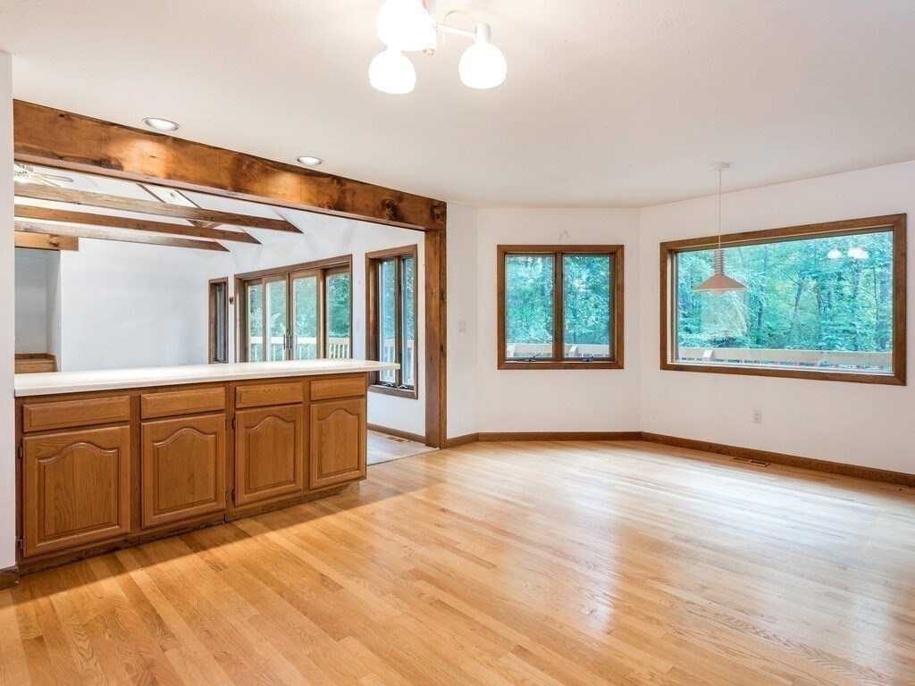49 Denfield Road Charlton, MA 01507 - Photo 6 of 42 a view of an empty room with window and cabinet
