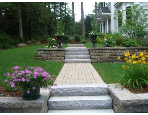125 Conant Road Weston, MA 02493 - Photo 2 of 16 a view of a garden with flowers