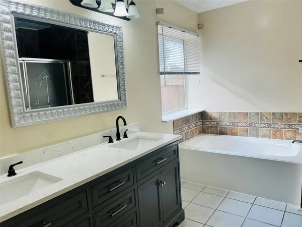 a bathroom with a sink and a bathtub