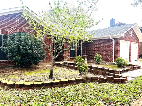 a front view of a house with swimming pool and sitting area