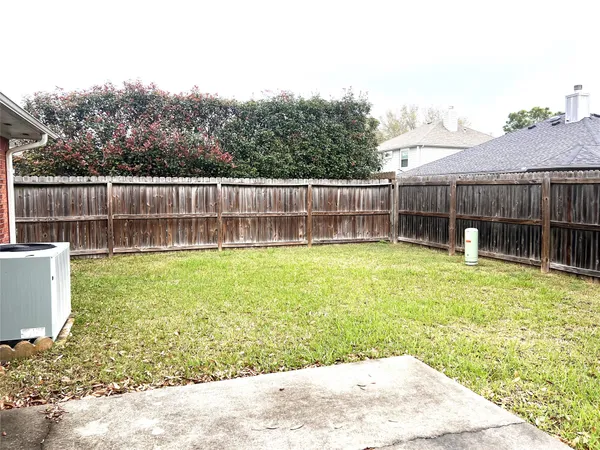a view of a backyard with a small cabin