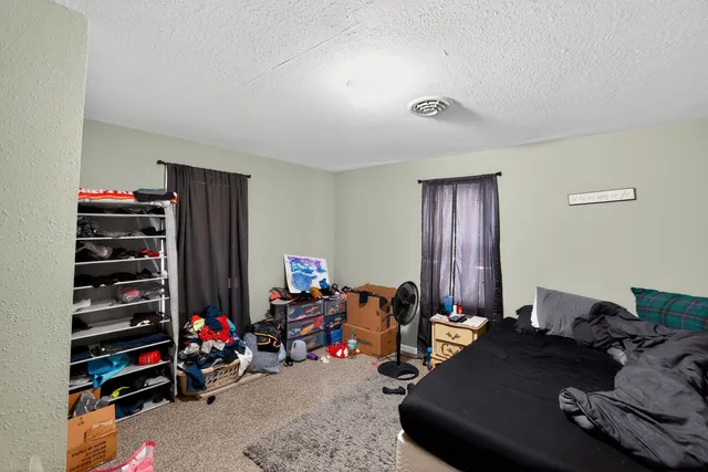 a view of a workspace with furniture and toys