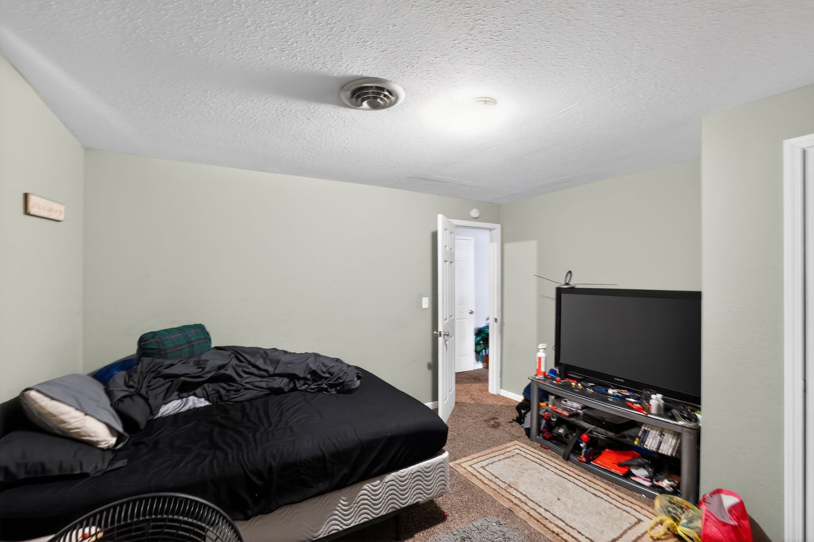 210 James Street Bethalto, IL 62010 - Photo 8 of 15 a bedroom with a bed and a flat screen tv