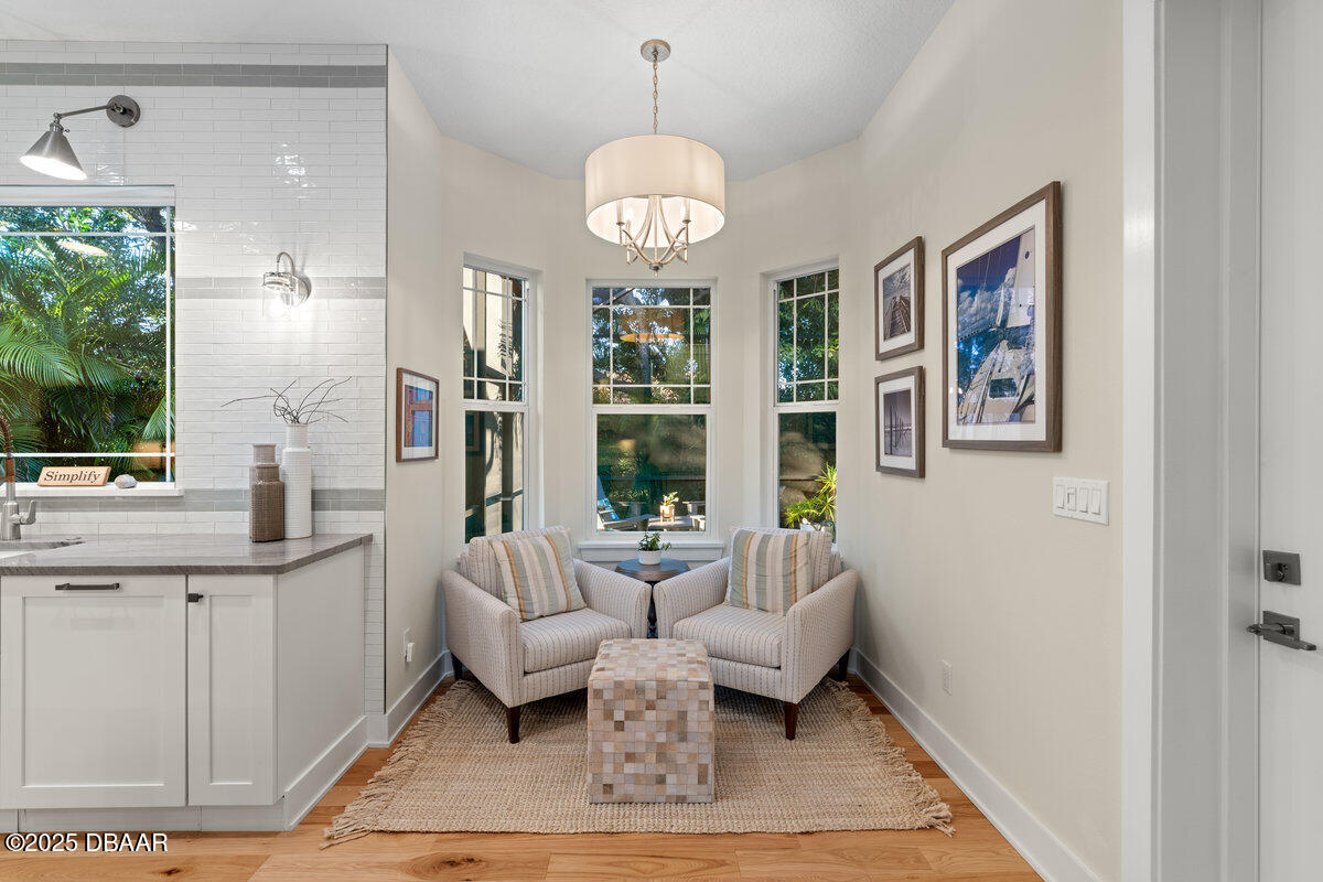 54 Ocean Way Drive Ponce Inlet, FL 32127 - Photo 14 of 76 a living room with furniture a large window and a dining table