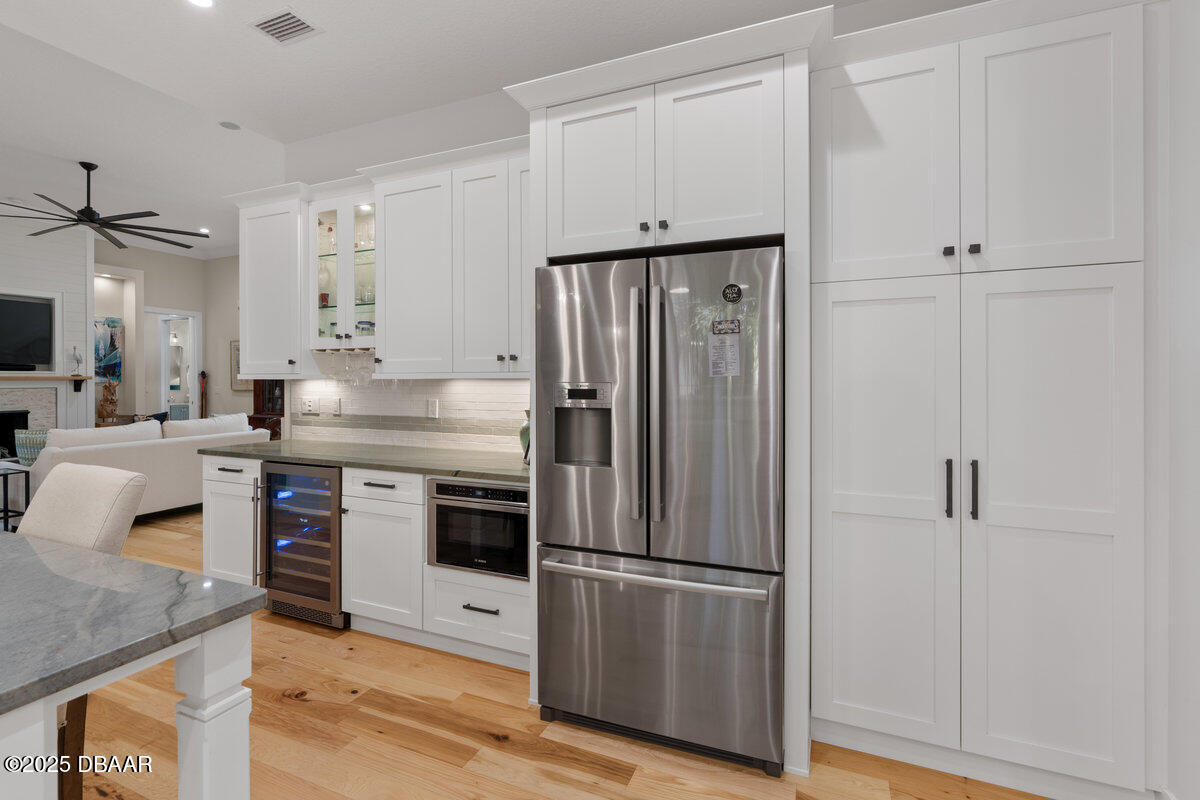 54 Ocean Way Drive Ponce Inlet, FL 32127 - Photo 19 of 76 a kitchen with stainless steel appliances granite countertop a refrigerator and a stove
