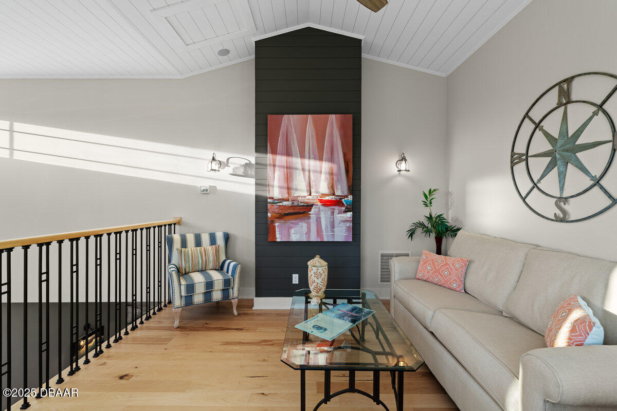 54 Ocean Way Drive Ponce Inlet, FL 32127 - Photo 32 of 76 a living room with furniture and a potted plant