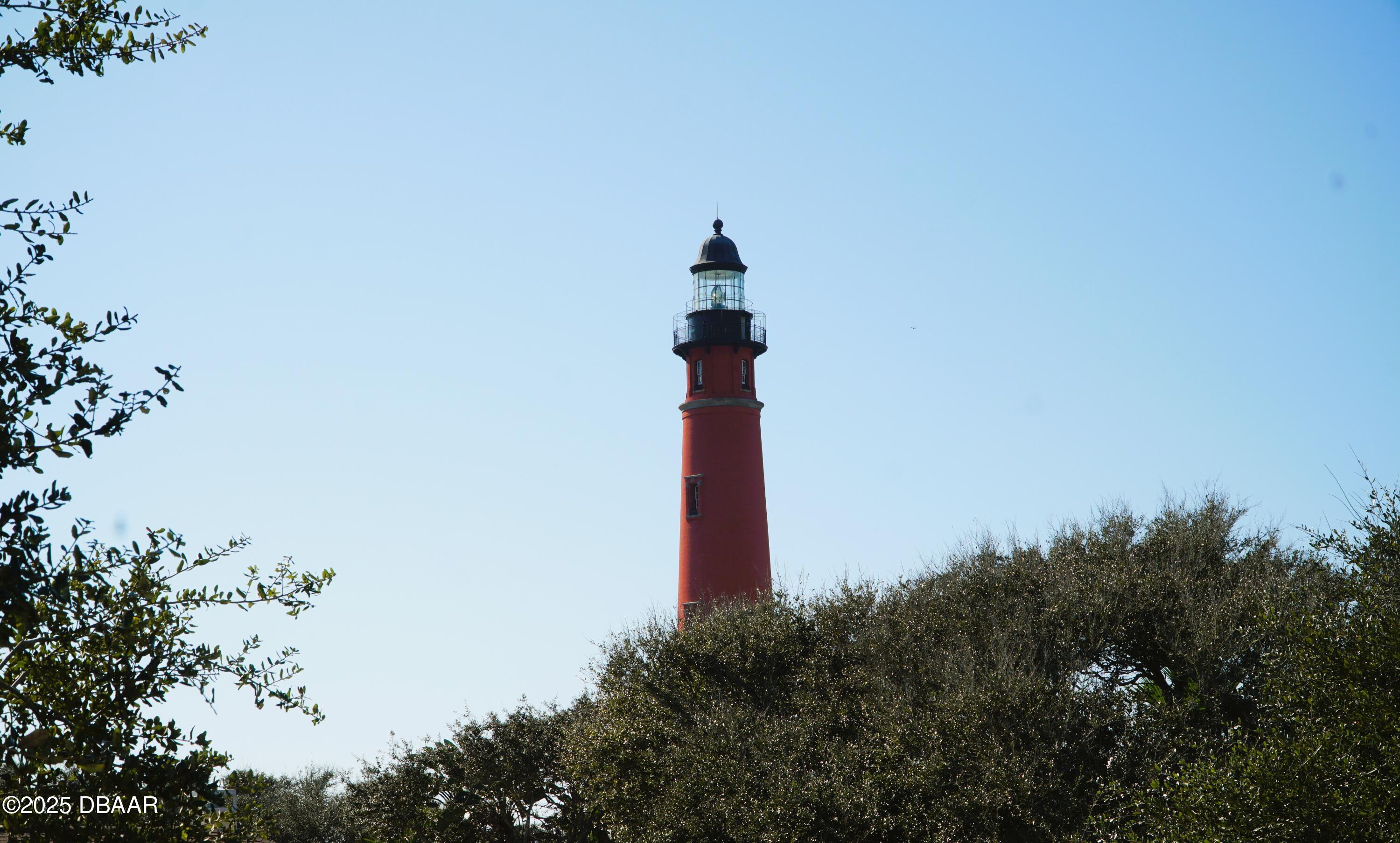 54 Ocean Way Drive Ponce Inlet, FL 32127 - Photo 36 of 76 a front view of a house with a yard and garden