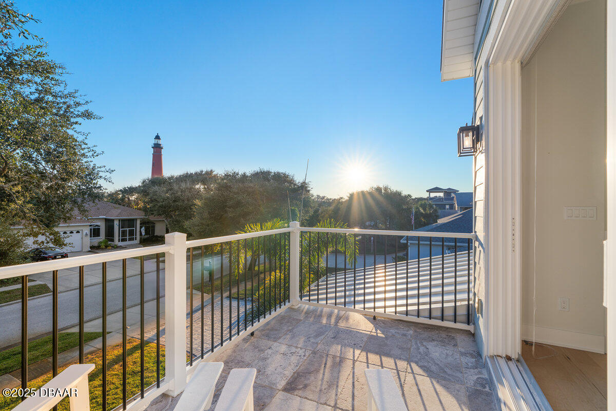 54 Ocean Way Drive Ponce Inlet, FL 32127 - Photo 37 of 76 a view of a balcony with wooden floor and fence